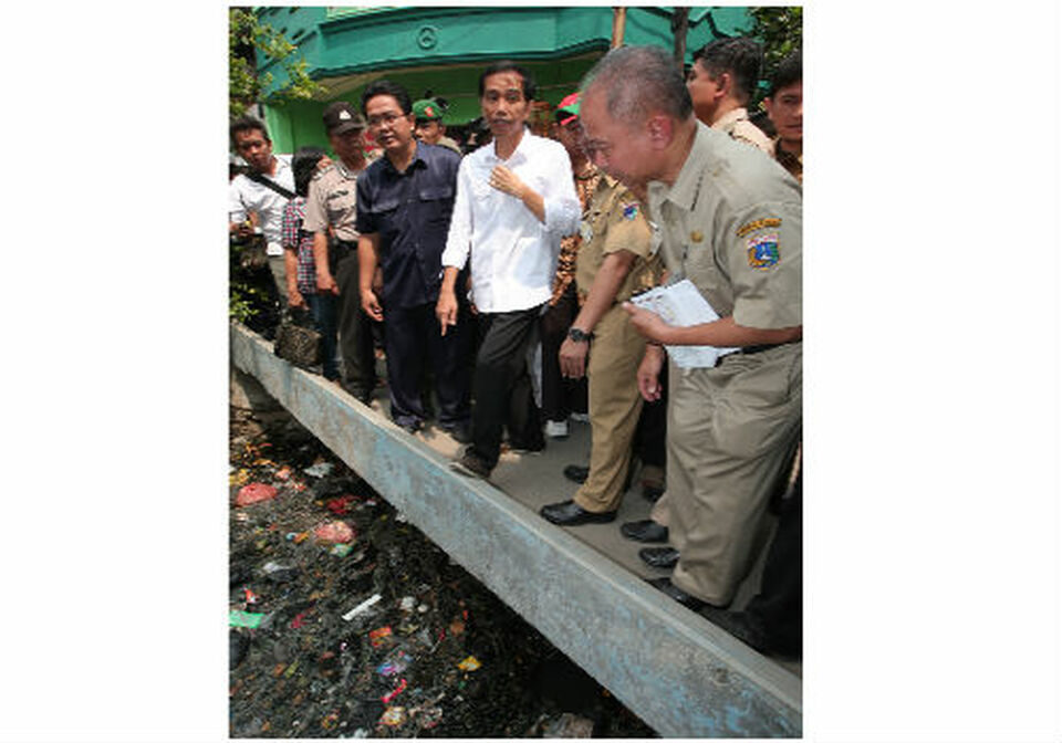 Jokowi Bungkam Ditanya Soal Banjir