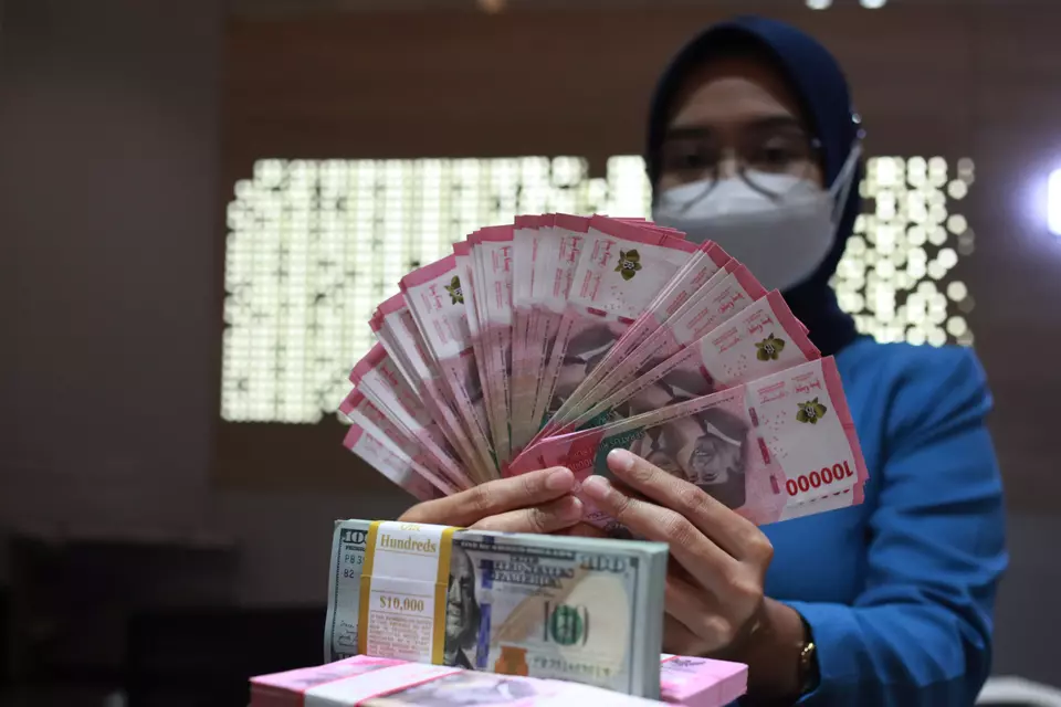 Ilustrasi rupiah dan dolar AS.