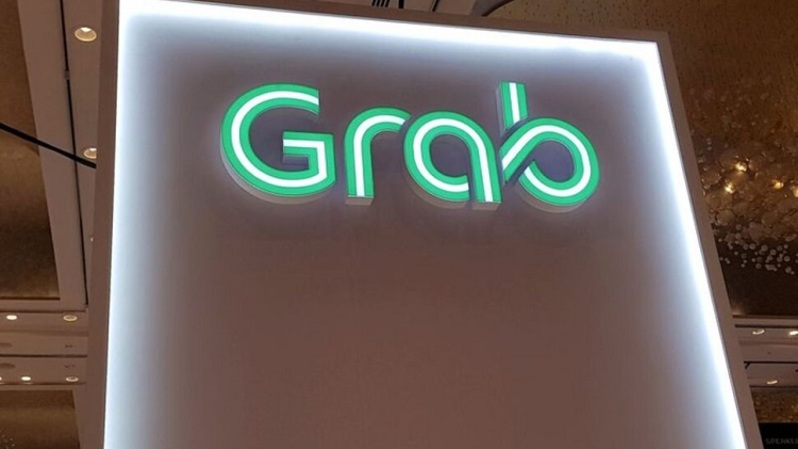 Logo Grab terlihat di Money 20/20 Asia Fintech Trade Show di Singapura, beberapa waktu lalu. (FOTO: REUTERS/Anshuman Daga/File Photo)