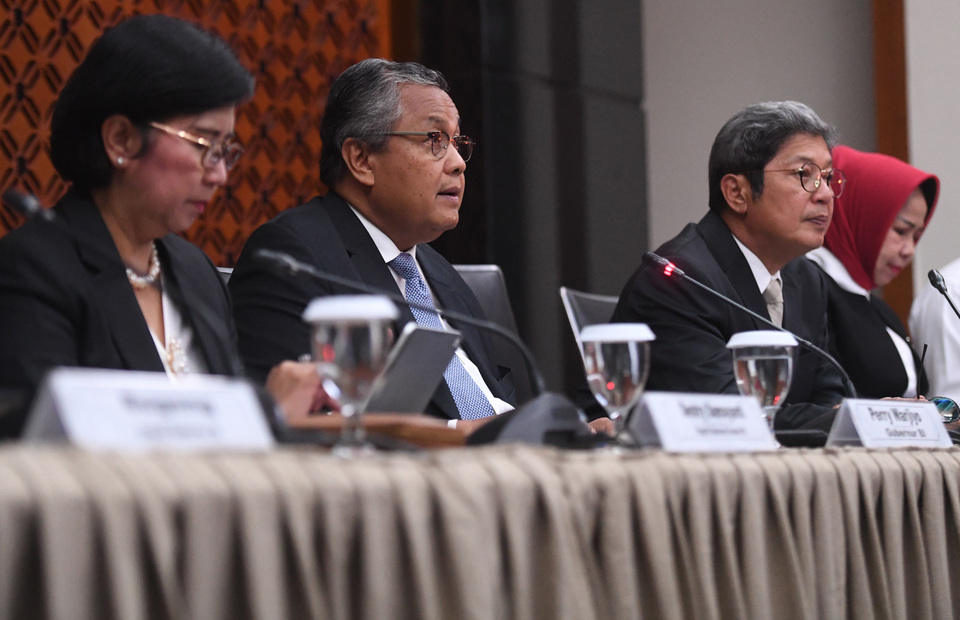 Bank Indonesia Governor Perry Warjiyo, center, said the Indonesian economy has left its worst period behind. (Antara Photo/Akbar Nugroho Gumay)