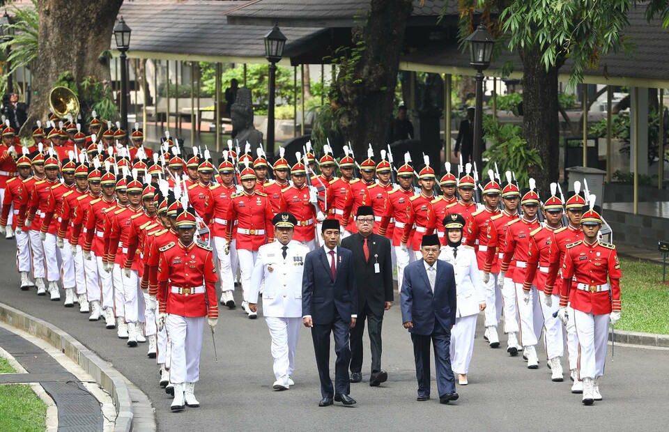File photo: President Joko Widodo leads a parade before the swearing-in ceremony of elected governors at State Palace in Central Jakarta on June 12, 2019. (Joanito De Saojoao)