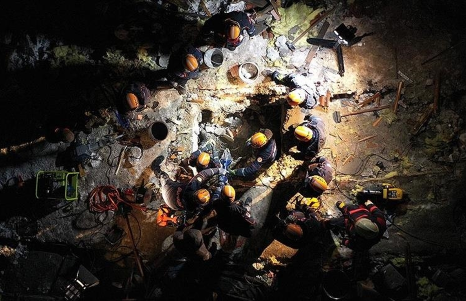 Rescue workers search for survivors after powerful earthquakes jolted Turkiye on February 6, 2023. (Anadolu Agency)