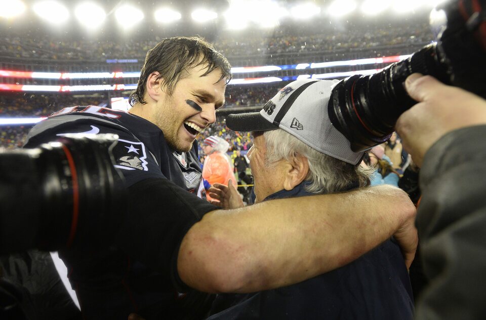 New England Patriots quarterback Tom Brady, left, and Patriots owner Robert Kraft, right, embrace after the AFC Championship game at Gillette Stadium in Foxborough, Massachusetts, on Jan. 18, 2015. (EPA Photo/C.J. Gunther)