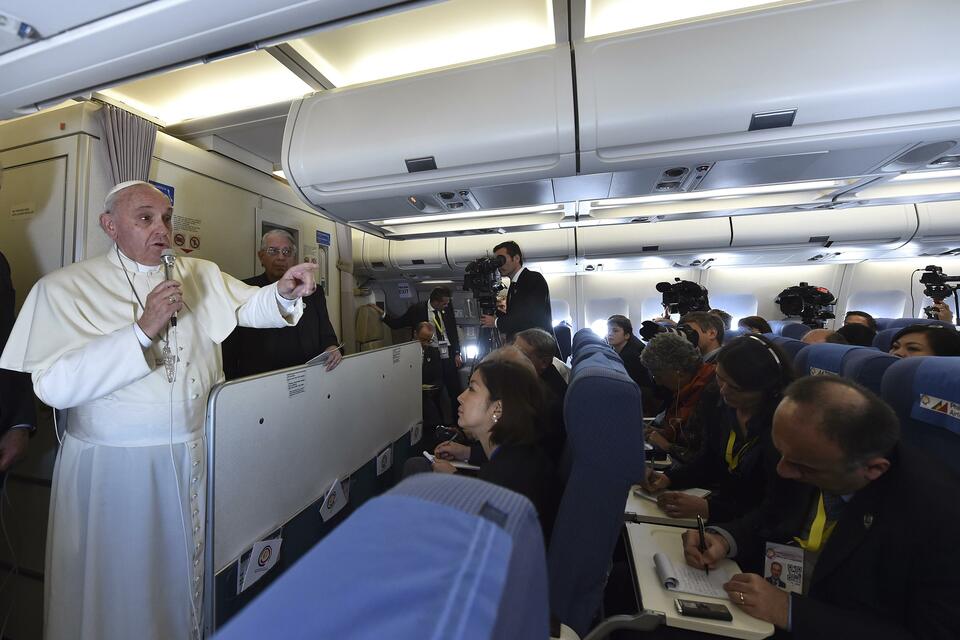 Pope Francis gestures as he speaks with journalists on his flight back from Manila to Rome on Jan. 19, 2015. (Reuters Photo/Giuseppe Cacace/Pool)