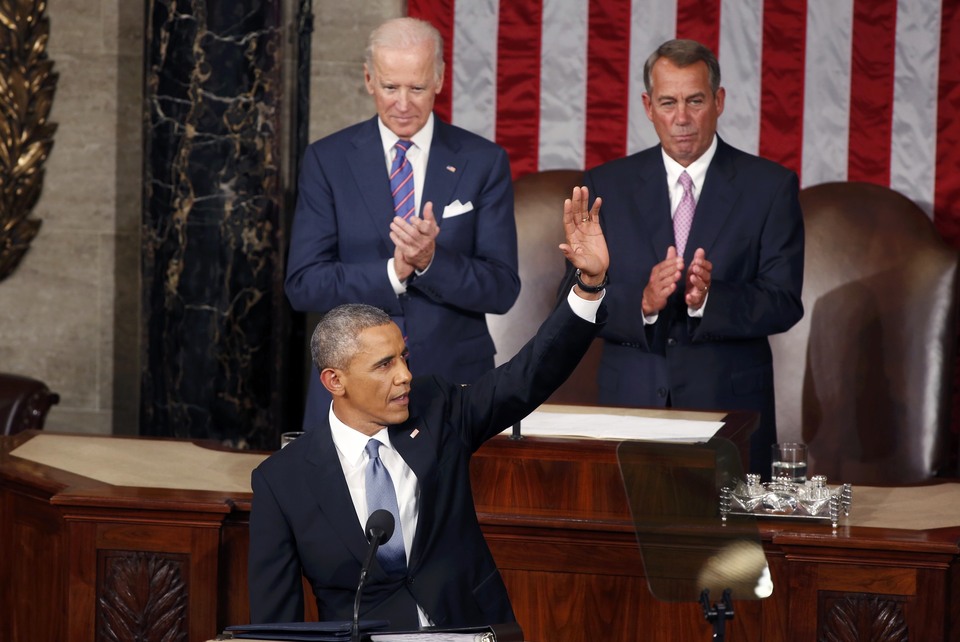 US Vice President Joe Biden, left, and Speaker of the House John Boehner applaud as President Barack Obama waves before delivering his State of the Union address on Tuesday. (Reuters Photo/Larry Downing)