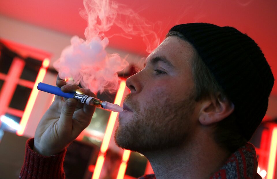 Consuming e-cigarettes is far safer and less toxic than smoking conventional tobacco cigarettes, according to the findings of a study analyzing levels of dangerous and cancer-causing substances in the body. (Reuters Photo/Mike Segar)