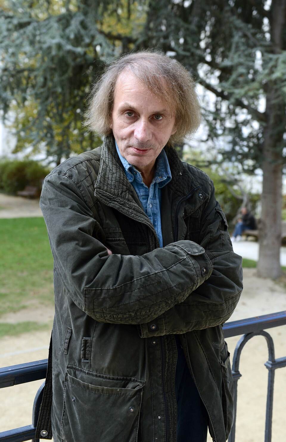 A file picture taken on Nov. 5, 2014 shows French writer Michel Houellebecq posing during his photo exhibition "Before Landing" at the Pavillon Carre de Baudouin in Paris. (AFP Photo/Miguel Medina)