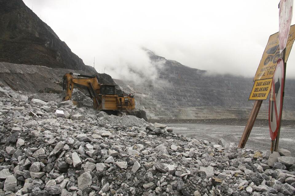 This file photograph taken on Aug. 16, 2013, shows a heavy machinery vehicle collecting rocks with ore deposits at Freeport-McMoRan’s Grasberg mining complex in Papua. (AFP Photo/Olivia Rondonuwu)