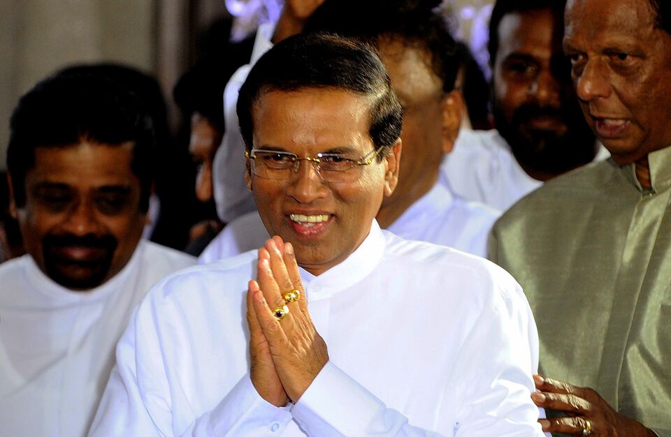 Sri Lanka's newly elected president Maithripala Sirisena gestures after being sworn in at Independence Square in Colombo on Jan. 9, 2015. (AFP Photo/Ishara S. Kodikara)