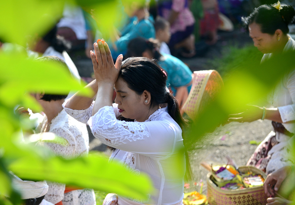 Balinese Hindus put away small amounts of money each week for years to afford the festivities and work on creating offerings for months. The event costs around $150,000 in total. (AFP Photo/Sonny Tumbelaka)