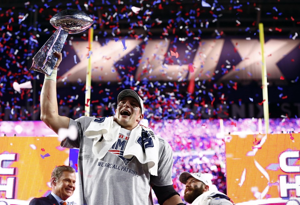 New England Patriots tight end Rob Gronkowski hoists the Vince Lombardi Trophy after defeating the Seattle Seahawks in Super Bowl XLIX at University of Phoenix Stadium on Sunday. (Reuters Photo/USA Today/Mark J. Rebilas)