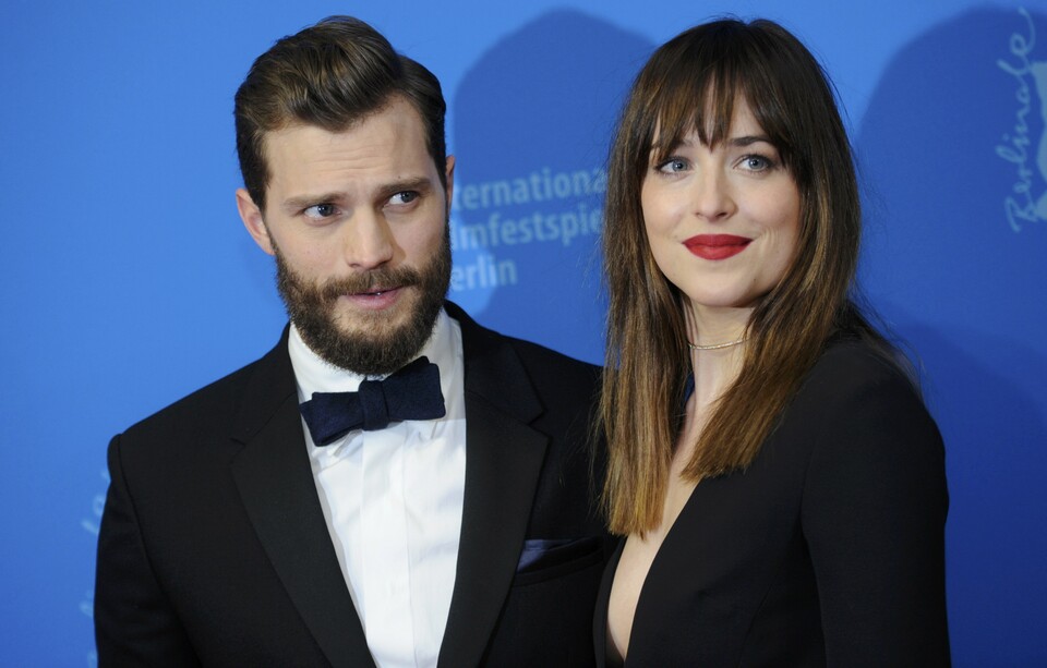 Actors Dakota Johnson and Jamie Dornan (left)  arrive for the screening of the movie 'Fifty Shades of Grey' at the 65th Berlinale International Film Festival in Berlin February 11, 2015.  (Reuters Photo/Stefanie Loos)