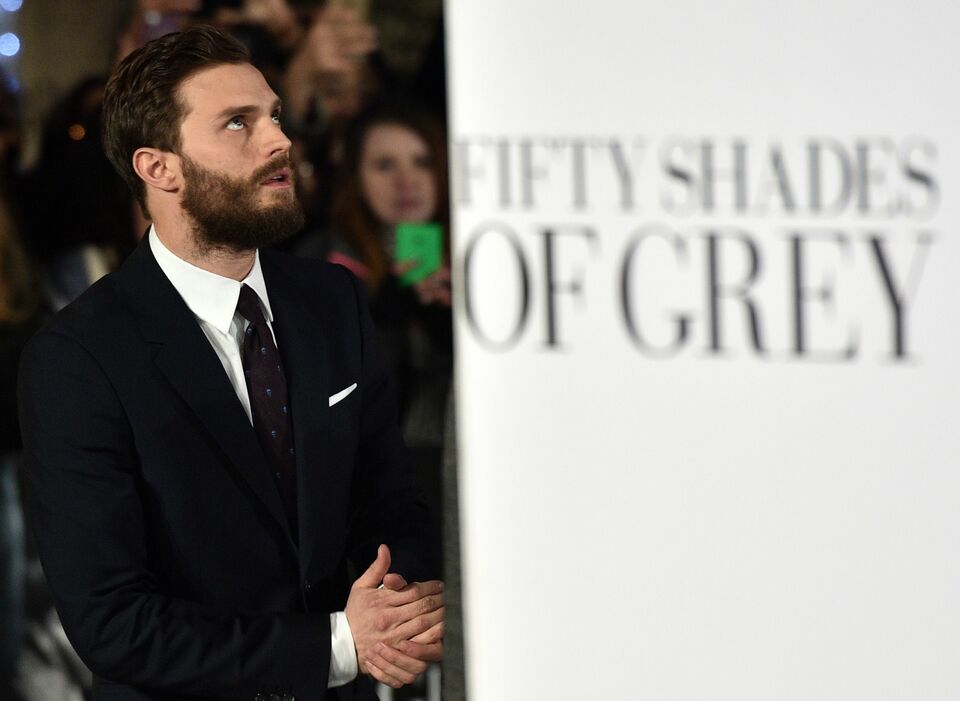 British actor Jamie Dornan poses for photographers ahead of the UK Premiere of 'Fifty Shades of Grey' in central London on February 12, 2015. (AFP Photo/Leon Neal)