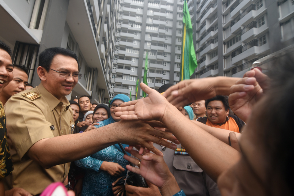 Jakarta Governor Basuki Tjahaja Purnama has spoken out against the government's new minimum wage policy. (AFP Photo/Zabur Karuru)