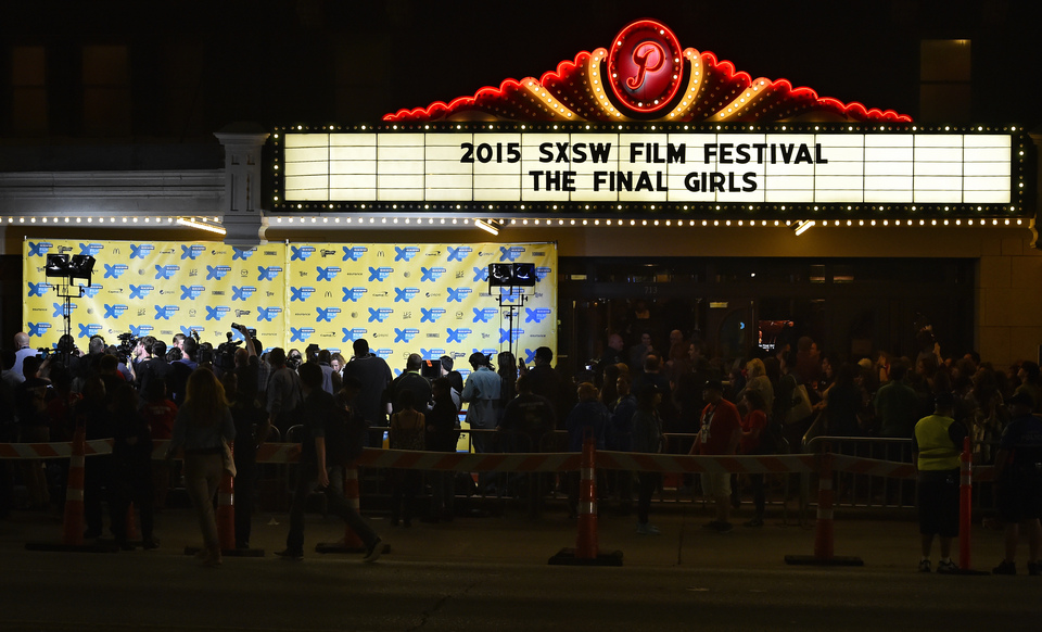 Photographers film outside a theater on the red carpet on the first day of South by Southwest in Austin, Texas, USA, 13 March 2015. South by Southwest (SXSW) Conferences and Festivals offer the unique convergence of original music, independent films, and emerging technologies.  (EPA Photo/Larry W. Smith)