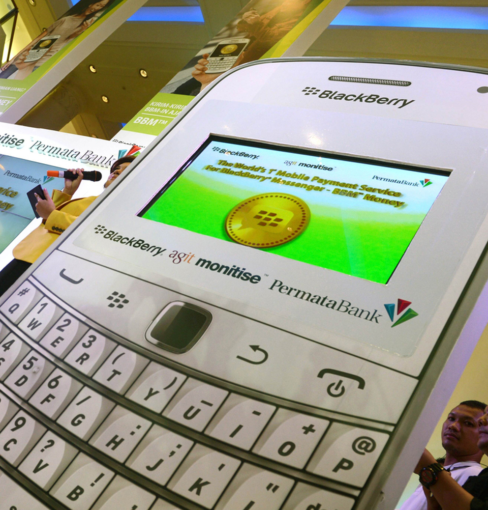  Wireless Cash Bank Permata seeks to promote itself as an innovator in Indonesia’s crowded financial services sector$98m booked by Bank Permata in fee-based income last year for services such as trade financing. A oversize phone demonstrates the app. (AFP Photo/ Romeo Gacad)