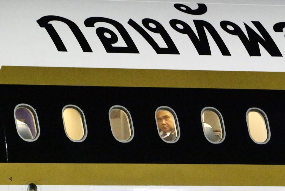 Thai Prime Minister Prayut Chan-o-cha gives looks at the aricraft window as he arrives  at Halim Perdana Kusumah Airport  in Jakarta, Indonesia, April 21, 2015. (EPA Photo/Bagus Indahono)