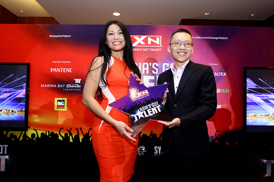 Anggun, left, poses with Ang Hui Keng from Sony Pictures Television Networks, Asia. (Photo courtesy of AXN)