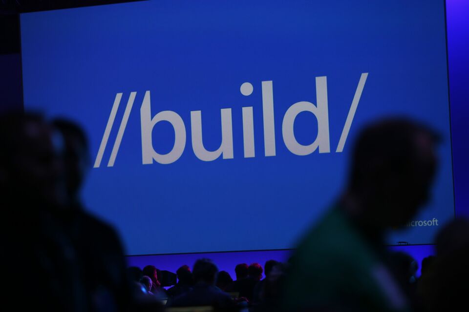 Attendees walk past a Microsoft Build sign during the 2015 Microsoft Build Conference on April 29, 2015 at Moscone Center in San Francisco, California. (Stephen Lam/Getty Images/AFP)