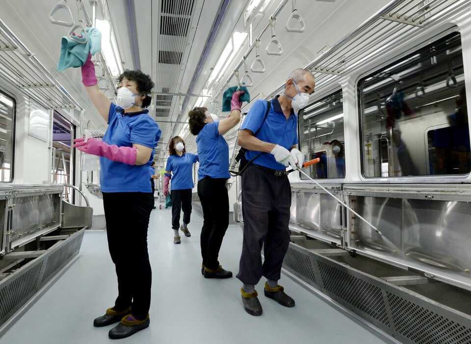Employees from Seoul Metropolitan Rapid Transit disinfect the interior of its train in Seoul, South Korea, as the number of MERS patients in the country rises to 145. (Reuters Photo/Park Jung-ho)