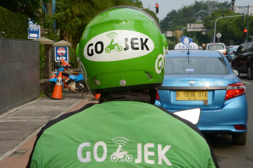 In 10 cities across Indonesia, half the total number of ojek drivers are employed by Go-Jek. (AFP Photo/Adek Berry)