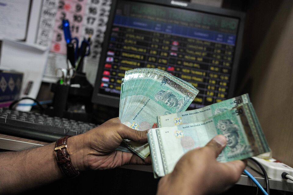 Equity and bond inflows turned positive for the week of July 15 in Asia while Latin America posted yet another week of redemptions from both these asset classes, according to EPFR data compiled by BNP Paribas. (AFP Photo/Mohd Rasfan)