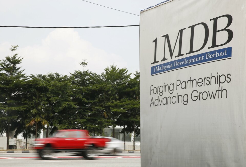 Malaysia has asked Interpol to try to locate a Malaysian financier for questioning over his suspected involvement in a multi-billion dollar scandal at state fund 1Malaysia Development Berhad (1MDB), the deputy prime minister said on Monday (23/10). (Reuters Photo/Olivia Harris)