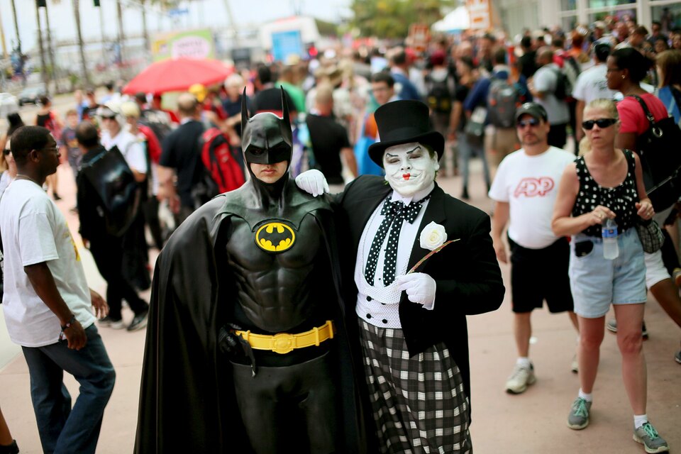 People dressed as a Batman and a Joker pose for pictures outside of the 2015 Comic-Con International in San Diego. (Reuters Photo/Sandy Hufftaker)
