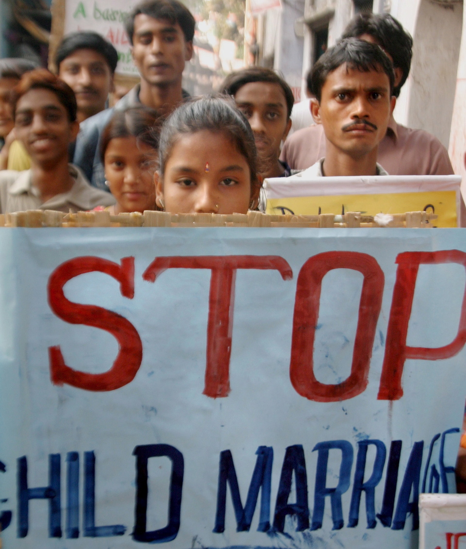 Sex workers and their children walk in a protest against child marriage in Calcutta, India, in 2006. (EPA Photo/Piyal Adhikary)