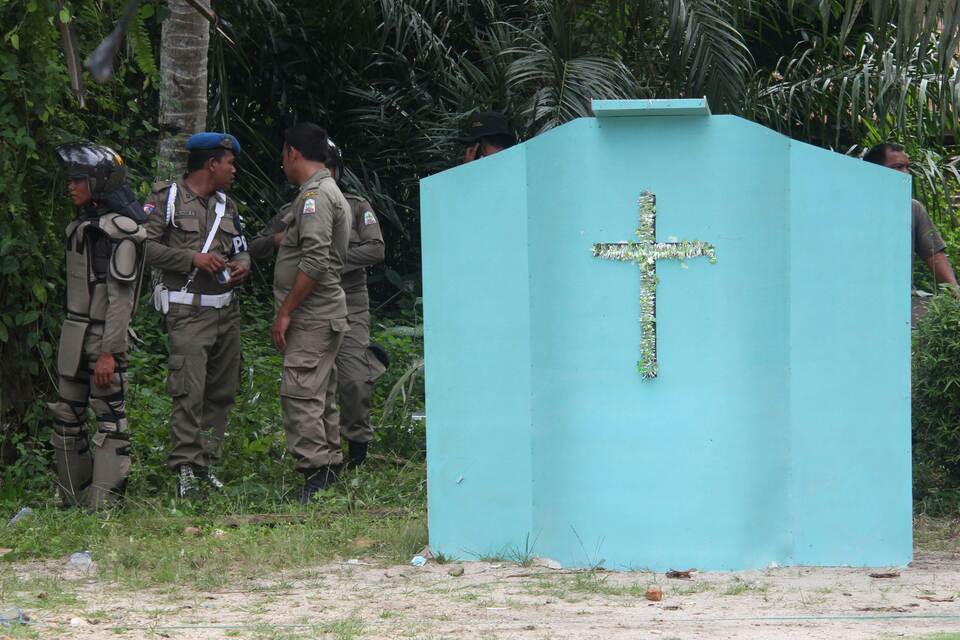 Authorities in Aceh province began tearing down several small Christian churches on Oct. 19, 2015 after hard-line Muslims demanded their closure, citing a lack of building permits, and following religious violence. (AFP Photo/Dian Majni) 