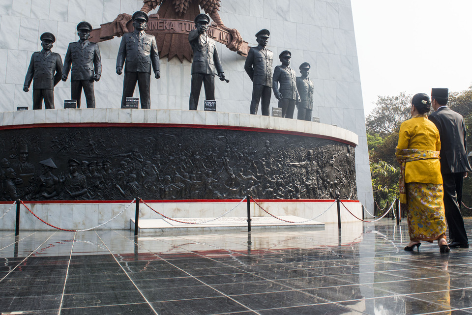 President Joko Widodo and first lady Iriana Joko Widodo during a visit to the Pancasila Sakti Monument in Lubang Buaya, East Jakarta. The monument commemorates the victims of the 30 September incident, which sparked the 1965-66 anti-communist purge. (Antara Photo/M. Agung Rajasa)