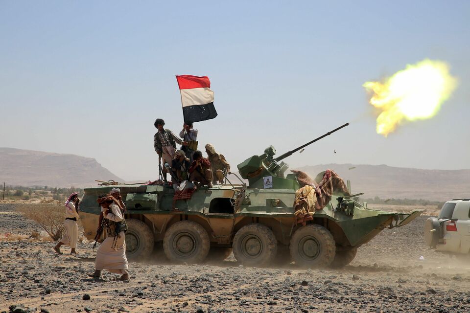 Armed Yemeni tribesmen from the Popular Resistance Committees, supporting forces loyal to Yemen's Saudi-backed President Abedrabbo Mansour Hadi, fire heavy artillery as they hold a position southwest of the city of Marib, east of the capital Sanaa. (AFP Photo/Abdullah Al-Qadry)