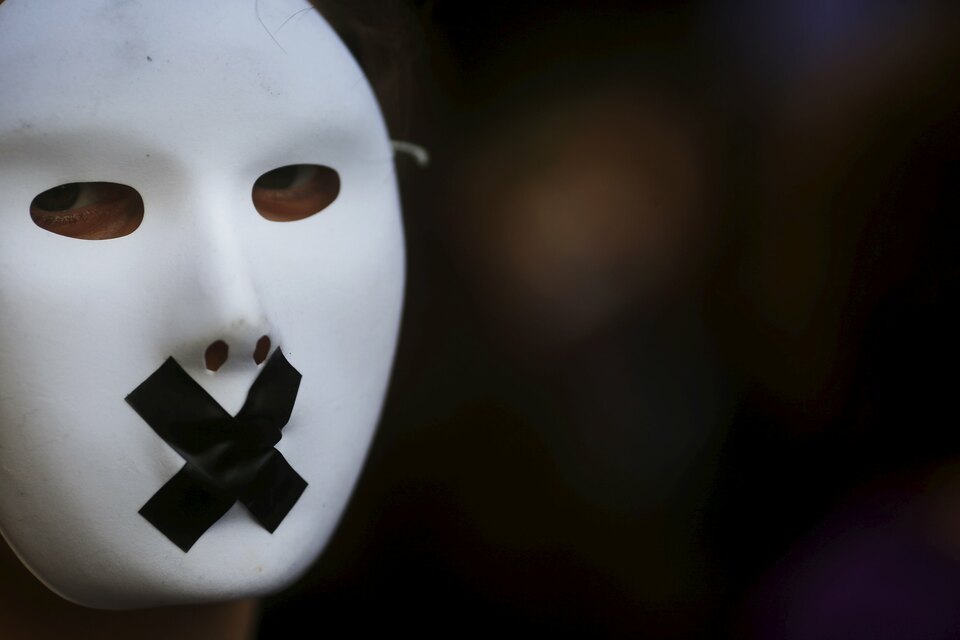 A woman wears a mask during a march against gender violence in central Madrid, Spain, on Nov. 7, 2015. (Reuters Photo/Susana Vera)