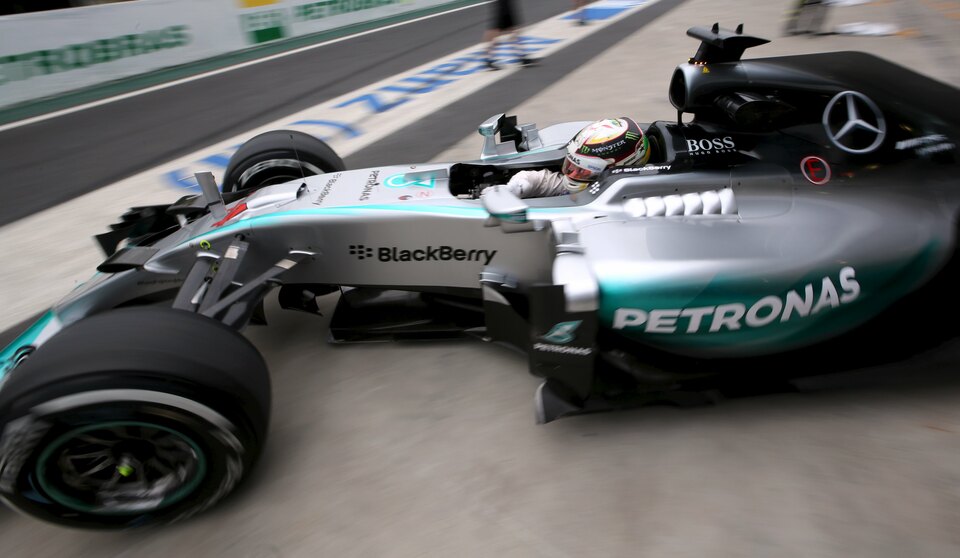 Information from more than 150 sensors on the car driven by triple world champion Lewis Hamilton travels from Sao Paulo to the Mercedes F1 factory in England, where ranks of engineers crunch the numbers, in a matter of milliseconds. (Reuters Photo/Paulo Whitaker)