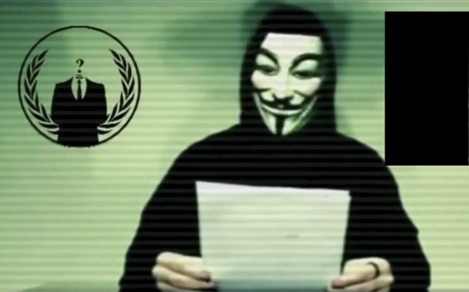 A man wearing a mask associated with Anonymous makes a statement in this still image from a video released on social media on November 16, 2015. Anonymous, the loose-knit network of activist hackers known for cyber attacks on government, corporate and religious websites, is preparing to unleash waves of cyberattacks on Islamic State following the attacks in Paris last week that killed 129 people, self-described members said in a video posted online. (Reuters Photo/Reuters TV)