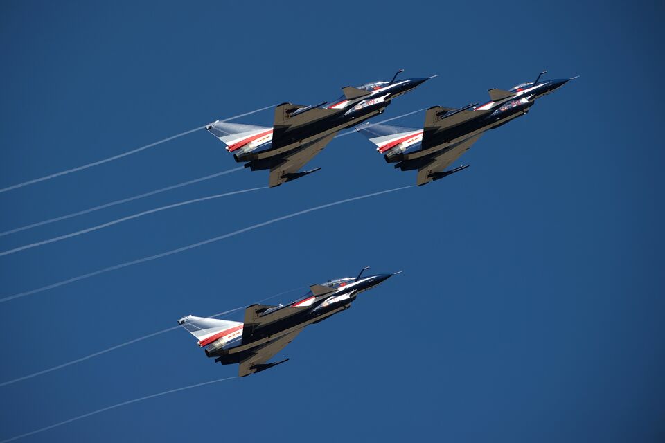 Three Chinese J-10 aircraft from the People's Liberation Army Air Force fly in close formation during the combined exercise ''Falcon Strike 2015'' at the Wing 1 Korat air base in Korat on November 24, 2015. Thailand and China have been conducting their first ever joint air force drill, a symbol of the blossoming military and political ties between the junta-run kingdom and its huge northern neighbour. (AFP Photo/Nicolas Asfouri)