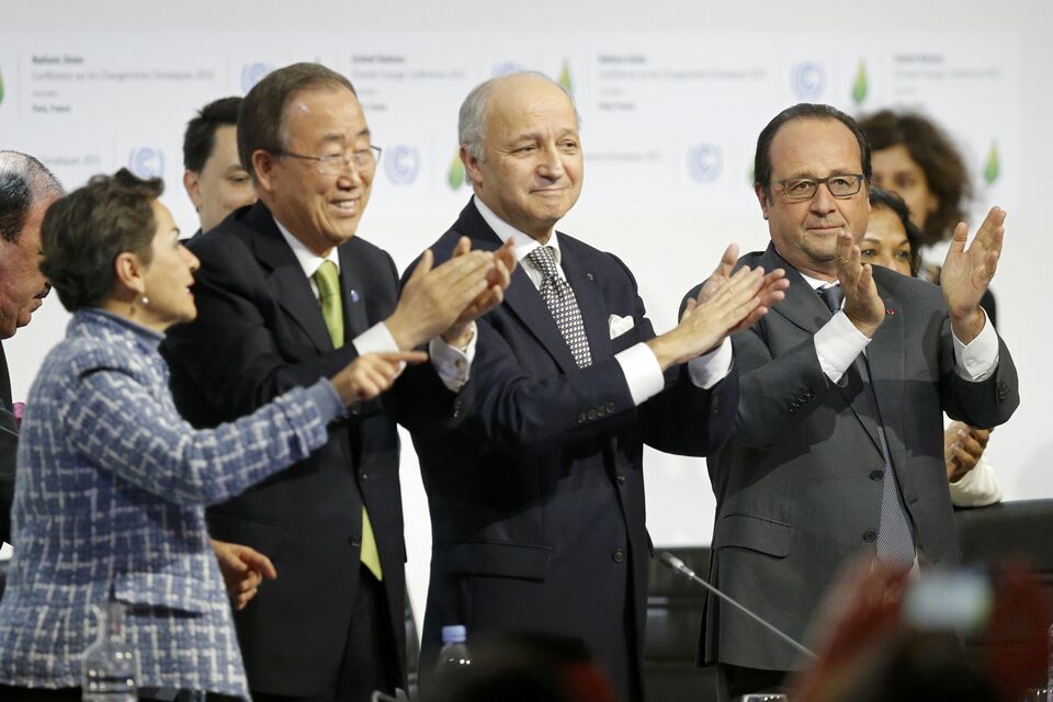 From left to right: Christiana Figueres, Executive Secretary of the UN Framework Convention on Climate Change, United Nations Secretary-General Ban Ki-moon, French Foreign Affairs Minister Laurent Fabius, President-designate of COP21 and French President Francois Hollande applaud during the final plenary session at the World Climate Change Conference 2015 (COP21) at Le Bourget, near Paris, on Dec. 12, 2015. (Reuters Photo/Stephane Mahe)