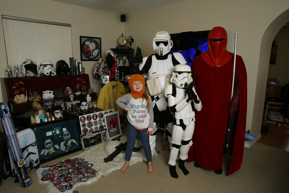Star Wars fans Chris Pellitteri, 45, (Scout Trooper) with his wife Christine, 36, (Royal Guard) son Jay, 8, (Stormtrooper)  and daughter Lily, 6, (Ewok) pose for a photo at their home in Rancho Cucamonga, California. (Reuters Photo/Reuters Photo/Mike Blake)