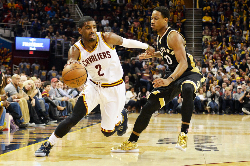 Cleveland Cavaliers guard Kyrie Irving (2) moves past Toronto Raptors guard DeMar DeRozan (10) during the fourth quarter at Quicken Loans Arena. The Cavs won 122-100. (Reuters Photo/Ken Blaze)