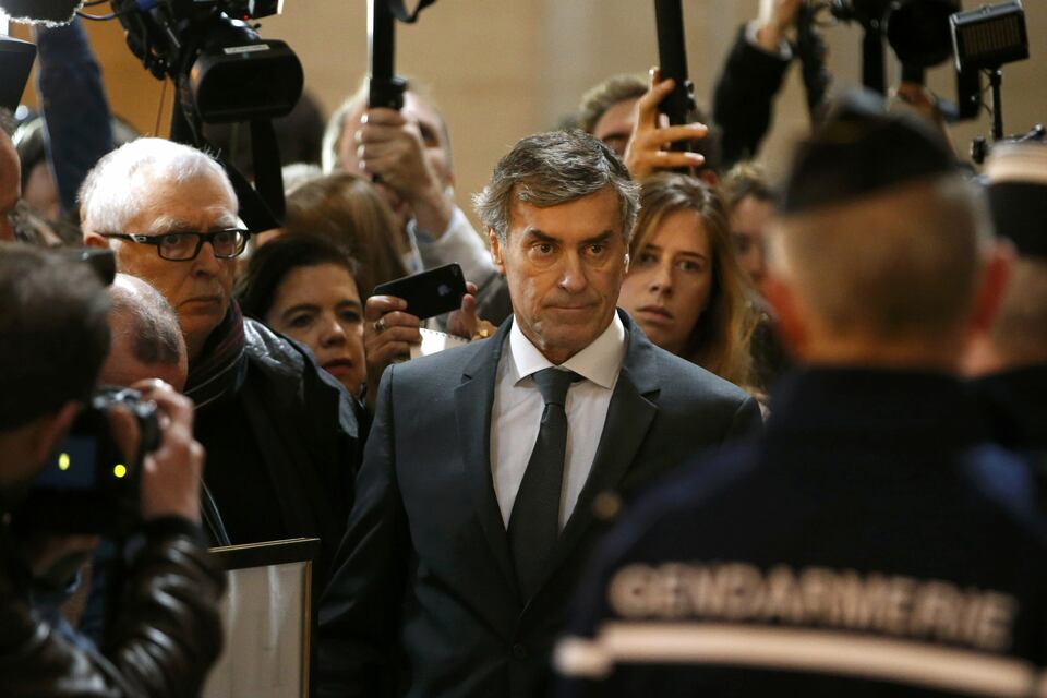 Former French budget minister Jerome Cahuzac, who resigned in 2013 after he admitted to have a Swiss bank account, arrives for the start of this trial for tax fraud at the courthouse in Paris on Monday. (Reuters Photo/Charles Platiau)