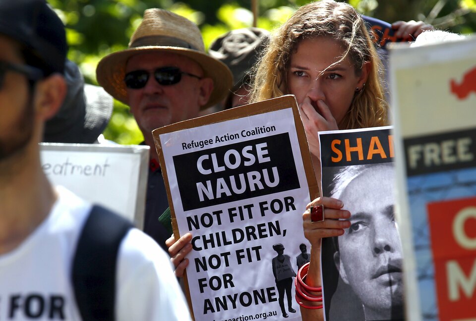 A protester holds a placard during a rally in support of refugees in central Sydney, Australia, in this file picture taken on October 19, 2015. (Reuters Photo/David Gray)