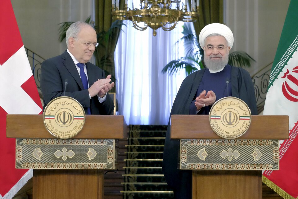 Switzerland said on Saturday it had agreed on a "road map" for building business, financial and other links with Iran after Swiss President Johann Schneider-Ammann met his counterpart Hassan Rouhani in Tehran. (Reuters Photo/Raheb Homavandi)