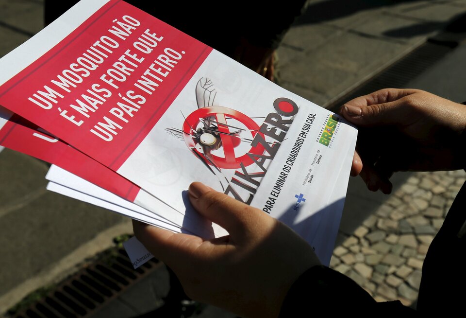 A Brazilian Army soldier shows pamphlets during the National Day of Mobilization Zika Zero in Rio de Janeiro, Brazil.  (Reuters Photo/Sergio Moraes)