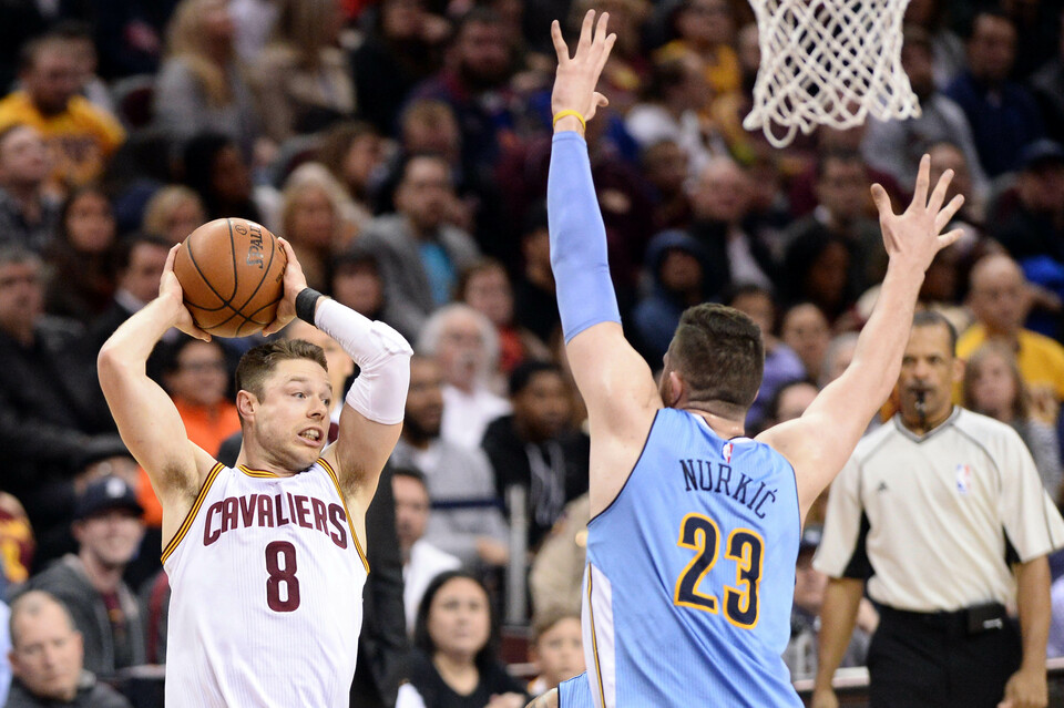 Cleveland Cavaliers guard Matthew Dellavedova (8) looks to pass as Denver Nuggets center Jusuf Nurkic (23) defends during the second quarter at Quicken Loans Arena. (Reuters Photo/ken Blaze)