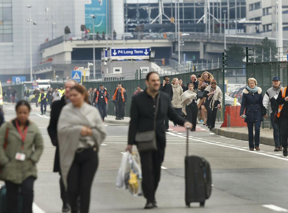 People leave the scene of explosions at Zaventem airport near Brussels, Belgium, March 22, 2016. (Reuters Photo/Francois Lenoir)
