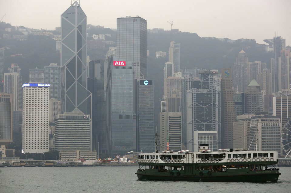 A ferry sails at Victoria Harbour in front of the financial Central district, featuring AIA Central (C) and Cheung Kong Center behind it, in Hong Kong, China. (Reuters Photo/Bobby Yip)
