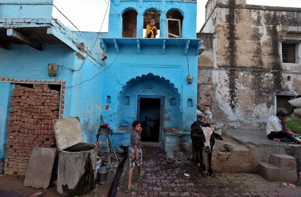 A boy makes his way into his house in the town of Barsana in the Uttar Pradesh region of India. (Reuters Photo/Cathal McNaughton)
