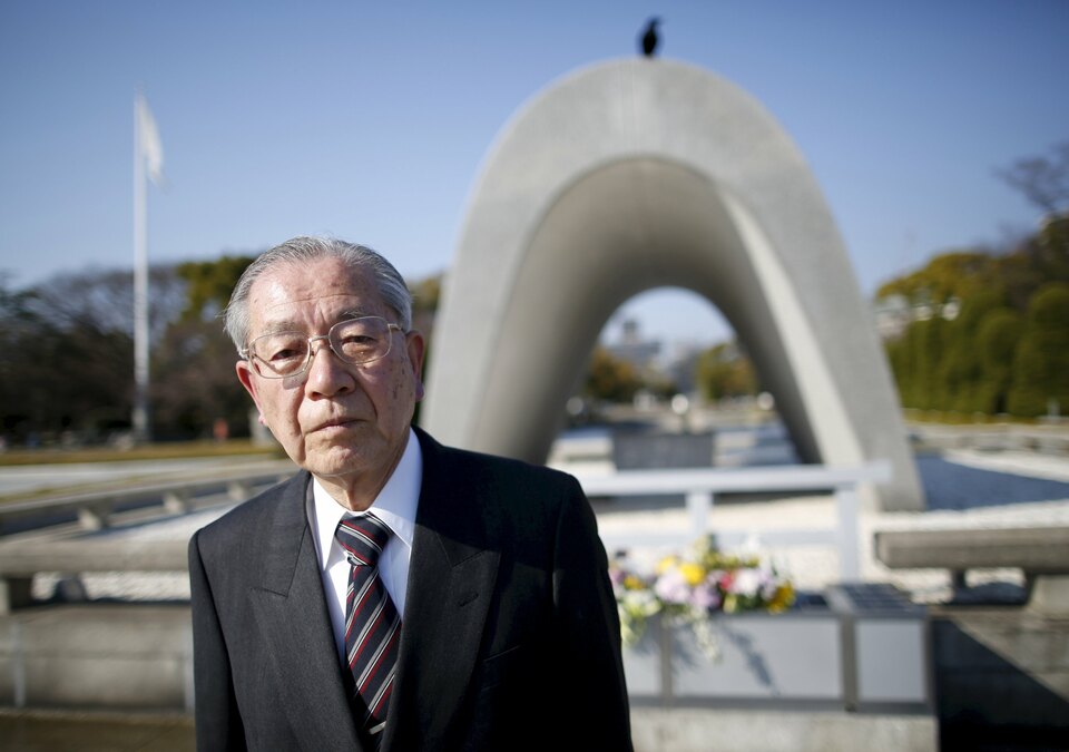 Hiroshi Harada, a 75-year-old atomic bomb survivor and former head of the Hiroshima Peace Memorial Museum, poses for a photograph in front of a cenotaph for the victims of the 1945 atomic bomb, in the Peace Memorial Park in Hiroshima, western Japan, in this March 26, 2015 file photo. (Reuters Photo/Issei Kato)