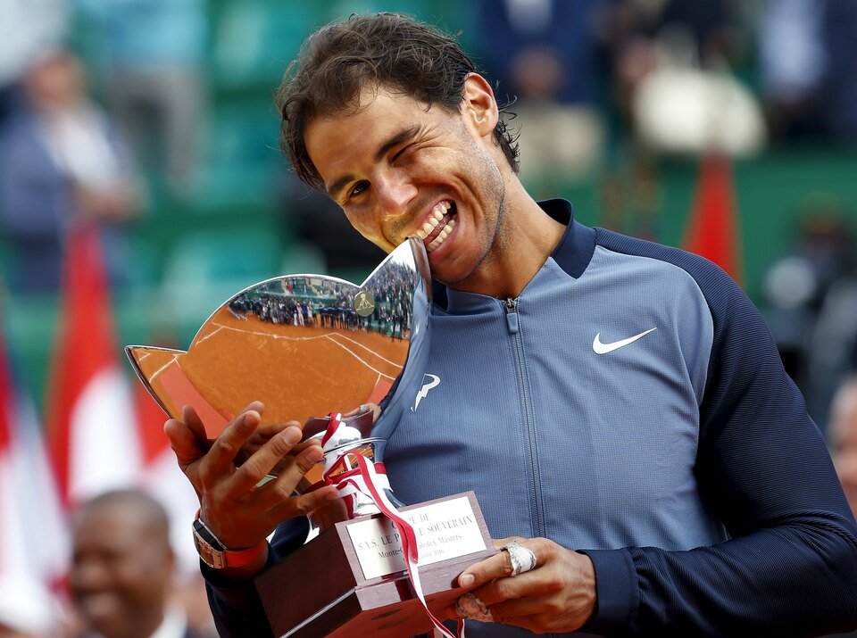 Rafael Nadal of Spain poses with his trophy after winning his final tennis match against Gael Monfils of France at the Monte Carlo Masters. (Reuters Photo/Eric Gaillard)
