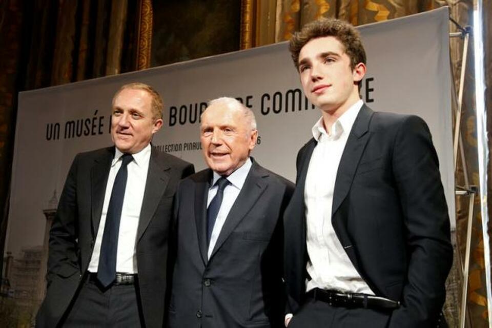 French businessman Francois Pinault, center, poses with his son Francois-Henri Pinault, CEO and Chairman of the board of directors of Kering, and his grandson Francois Pinault after a news conference to announce plans for Paris art museum, at the Town hall in Paris, France, April 27, 2016.   (Reuters Photo/Charles Platiau)